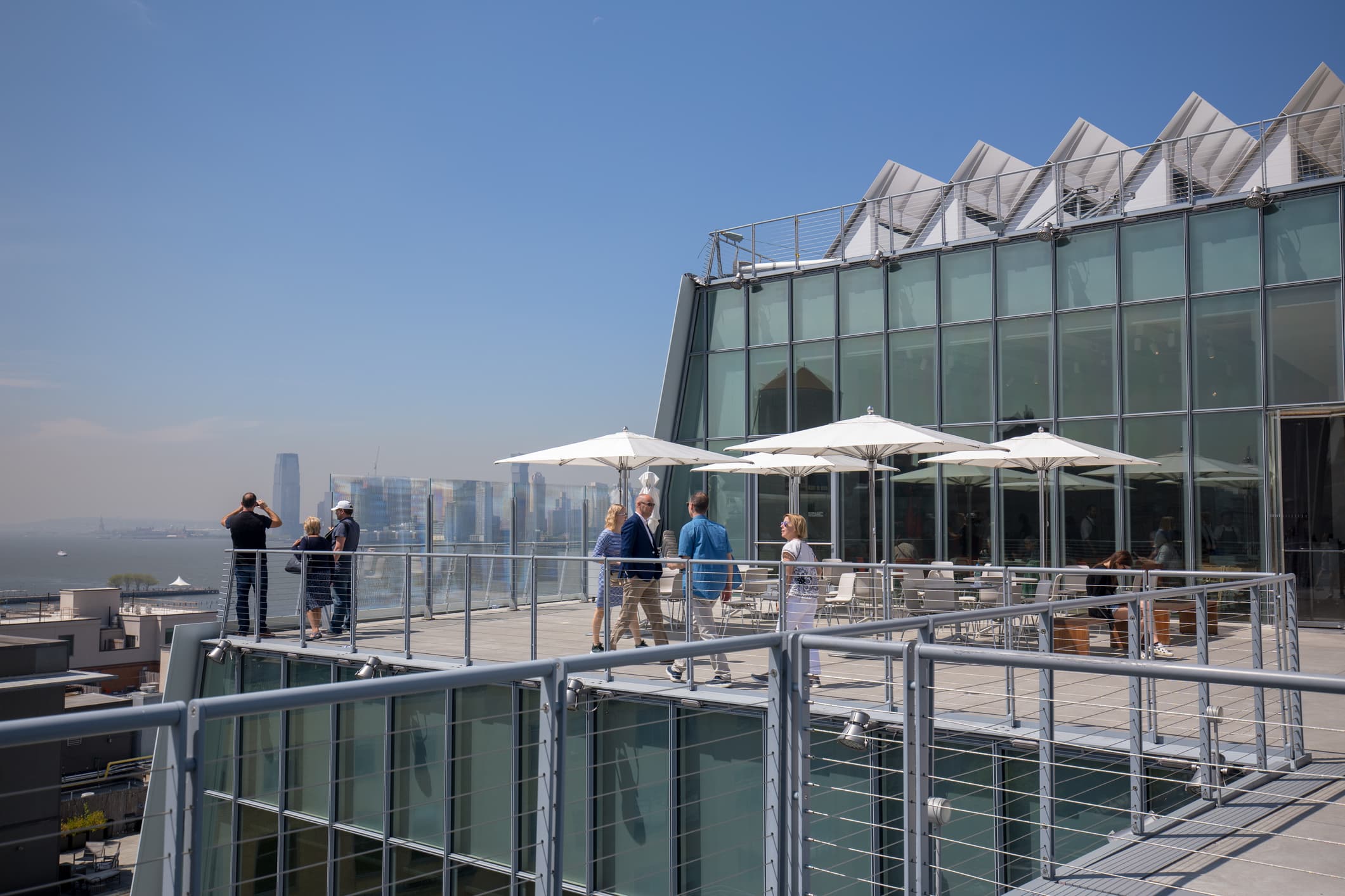 People on roof deck of modern building